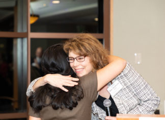 Judge Terry Fox Receives CWBA Award for Service to Legal Profession Two women hugging
