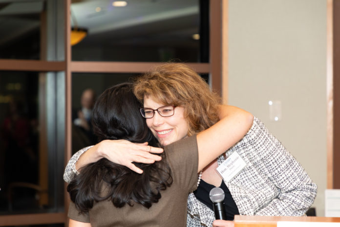 Two women hugging