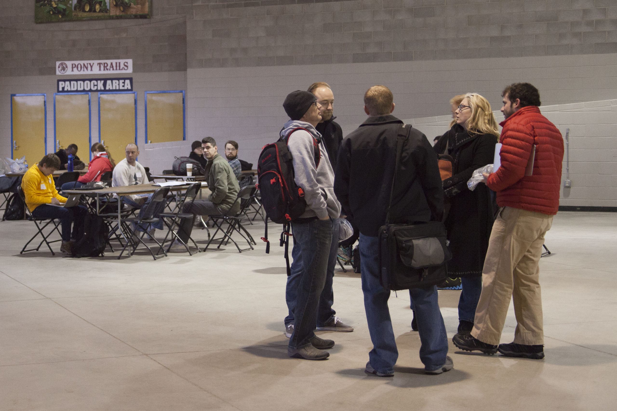 A group of four people in a circle talking