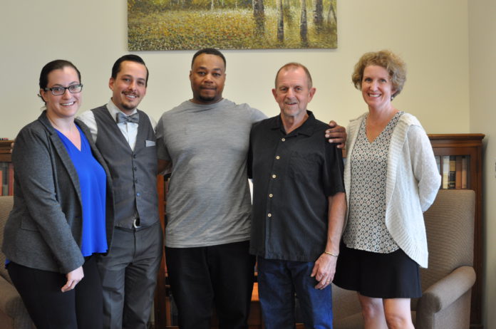 Alvin Green poses with the attorneys who helped him in his clemency case.