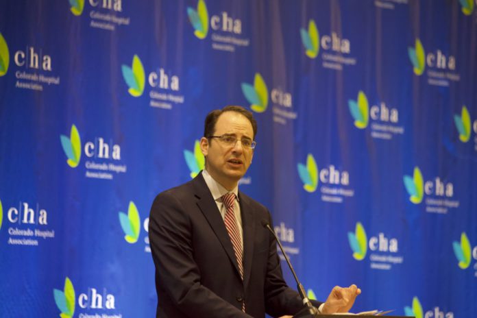 Phil Weiser speaks at an event in 2019.