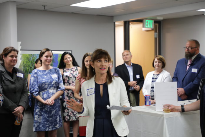 Legal Entrepreneurs for Justice founder Laurie Gilbertson talks to a group