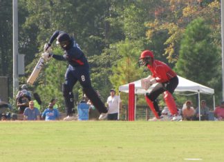 USA Cricket Moves to Dismiss ‘Disgruntled’ Bidder’s Claim Two cricket players, one in blue and one in red playing against eachother