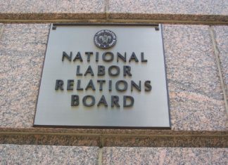 NLRB Floats New Election Rules A metal plaque on a marble wall with the title National Labor Relations Board
