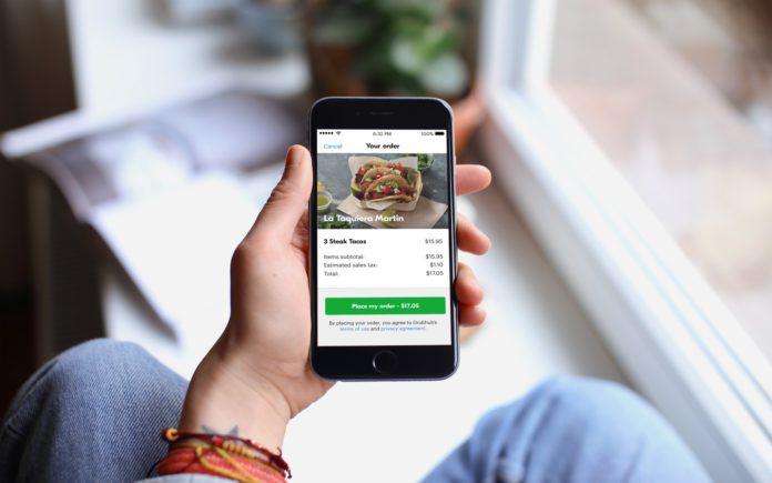PlaceMyOrderPage-A A cell phone shows the order screen on the Grubhub app