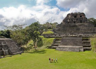 CU Project Seeks to Implement Land Rights Granted by Caribbean Court An ancient aztec temple made of stone in a green field
