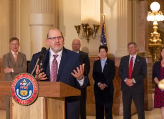 One Year In Colorado Supreme Court Justice Carlos Samour speaks behind a podium