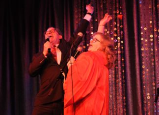 A Night at the Cabaret A woman and man throw their hands up in the air while they perform in the 19th “Ethics Revue”