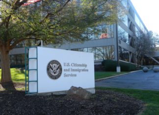 Technology and Social Media Increase Deportation Risks A big white sign that reads U.S Citizenship and Immigration Services