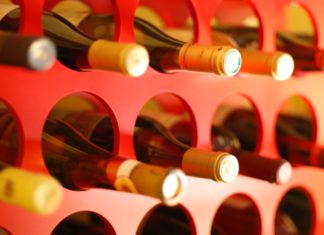 Purchase Doesn’t Equal Property Ownership in ‘Missing Wine’ Decision Wine bottles laying down stacked in circular holes