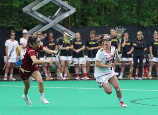 Supreme Court Considers NCAA Antitrust Case Two college athletes play in a lacrosse game