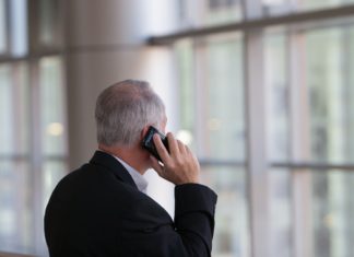 Senate Considers Telehealth Reimbursement for Dentists Man on a phone call