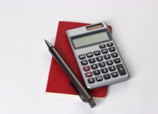 Pandemic Brings Unpredictability for Commercial Property Assessments Calculator and notepad