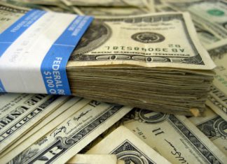 Governor Signs Immigration Detention Defense Fund into Law A stack of money