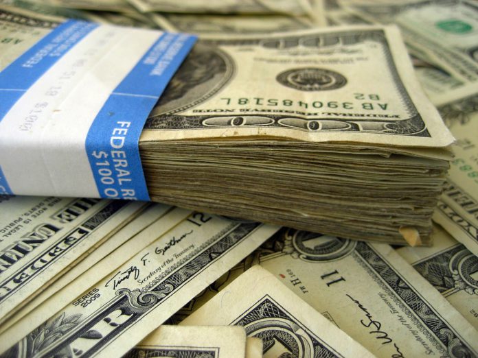 6280510901_94a4e8f7e7_b A stack of money