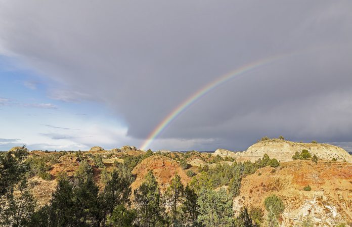 A rainbow over badlands in ND.