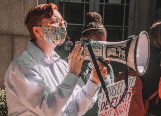 The History Behind Colorado’s ‘Limited Loading Buffer Zone’ Pro-life protestors use a megaphone.