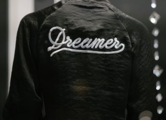 DACA Dangers: Permanent Injunction Places Halt on New Applicants, Leaves Existing Applicants With Options Someone faces away wearing a Dreamers jacket.