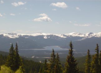 Lake County War Claims the Life of a Probate Judge in Court in 1874 A picturesque lake lit by a bright, sunny day