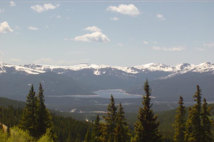 A picturesque lake lit by a bright, sunny day