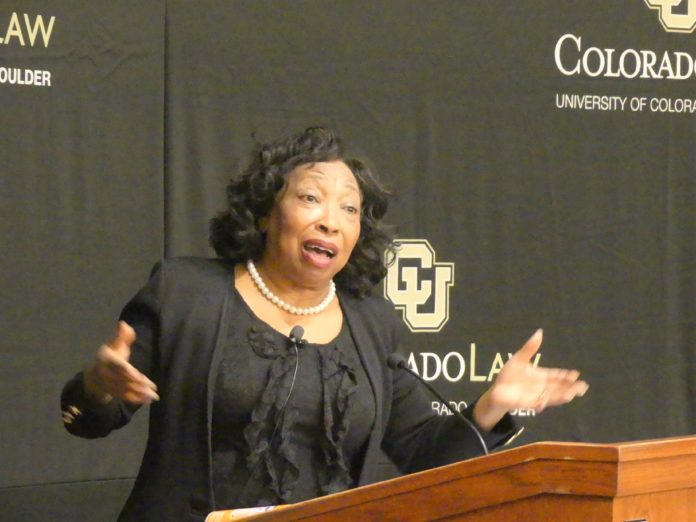 Stevens Lecture Photo 2 Judge Bernice Donald of the 6th Circuit Court of Appeals speaks with arms outstretched at a podium at the 2021 John Paul Stevens Lecture at CU Law School.