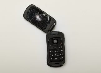 ‘You’re Dealing With a Crazy Person’: Denver Man Sentenced for Threatening to Murder Social Security Employee A flip-phone sits ripped in half with a cracked screen.