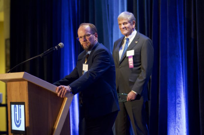 Timothy Schutz speaks at the 2019 Colorado Judicial Institute awards dinner