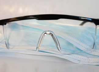 Sixth Circuit Denies Order to Expedite OSHA ETS Proceedings Safety goggles on top of disposable face masks