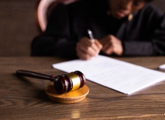 Senators Bennet and Hickenlooper Introduce Bill to Add CO District Judges Judge writes behind a gavel