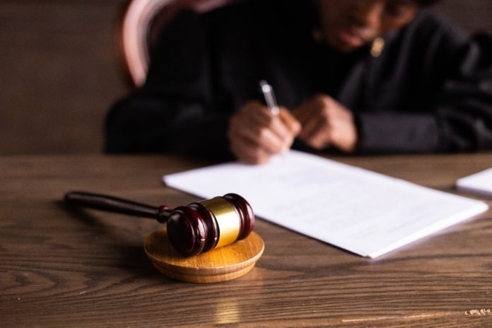 pexels-ekaterina-bolovtsova-6077447 Judge writes behind a gavel