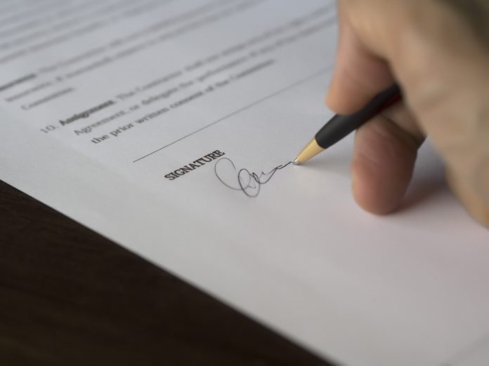 A person signing a contract