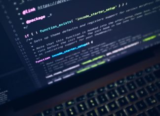 NIJ Funds Two New Projects to Improve Collection of Digital Evidence a laptop screen shows lines of coding
