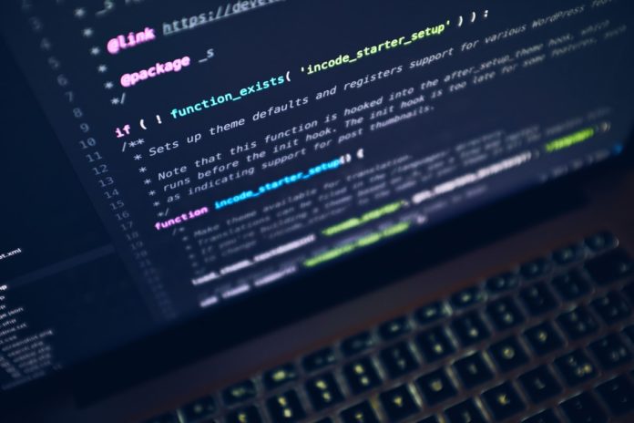 photo-1488590528505-98d2b5aba04b a laptop screen shows lines of coding