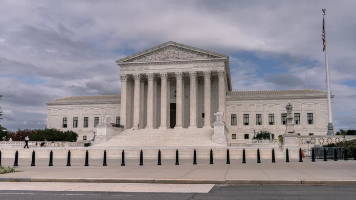 U.S Supreme Court House. Large white building with pillars and tall stairs