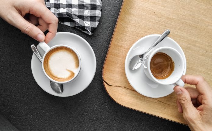 two coffee cups on a table