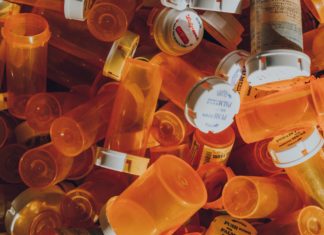 Proof of Intent Required to Convict Doctors Under CSA, Supreme Court Rules A pile of empty, orange prescription bottles most without labels and a few with unreadable labels.