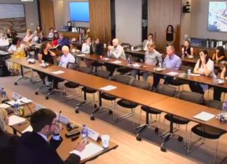 CU Law School Panel Reflects on SCOTUS Term A birds eye view of a conference room hosting a panel and audience.