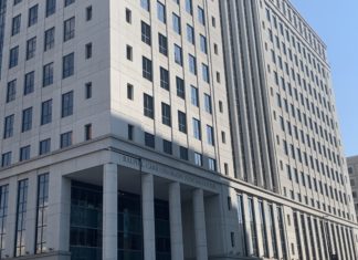 Lawmakers Publish First Drafts of Judicial Reform Bills The Ralph Carr Judicial Center. A tall gray building with column at the bottom.