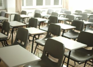SCOTUS Decisions Could Have Major Impact on Schools in Colorado An empty classroom filled with desks for students.