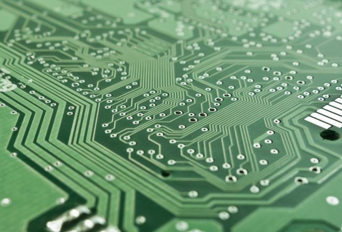 pexels-pixabay-50711 A zoomed in green circuit board.