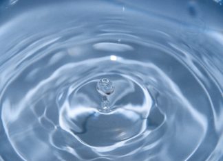 Recent Colorado Court of Appeals Decision Makes Waves for Water Utility, Landowners A droplet of water causes waves to move outward.