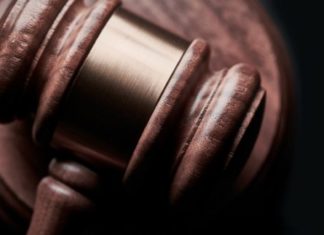 A Brief History of the Era of ERA a gavel rests on a desk.