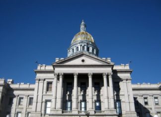 Preview: Colorado General Assembly Session Begins Jan. 9 An image of a large concrete building with multiple pillars in front. The top of the building is a dome.