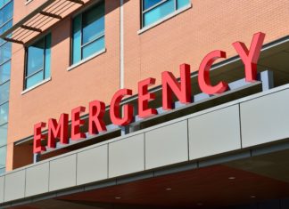 Proposed Bill Hopes to Curb Coloradans Healthcare Debt A sign that reads “Emergency” in the color red can be seen.