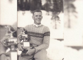 Remains Dating Back 50 Years Found in Lake County Identified Gardner Paul Smith is smiling and holding a ski trophy and gloves while wearing a striped sweater with a collared white shirt underneath. The photo looks very old.