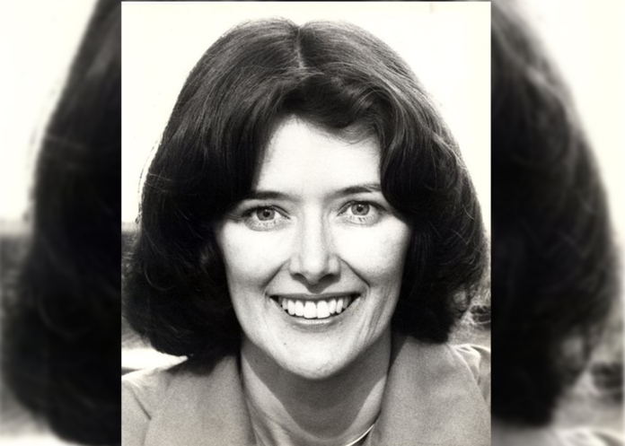 in a black and white photo, Pat Schroeder is smiling widely. She’s got short, dark hair and it looks like she may be wearing a tan or light-colored blazer.