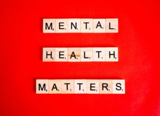 Colorado General Assembly Continues Discussions on Mental Health Matters “Mental Health Matters” is spelled out using tiles from a Scrabble board. Behind it is a red background.