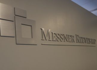 Messner Reeves Marks 28 Years with a New Space and a ‘Balance’ Mindset A silver brushed chrome logo that reads Messner Reeves on a white wall.