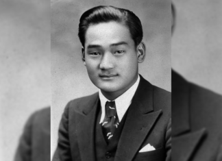 Minoru Yasui’s Values Live on in Colorado Inn of Court A young man poses for a picture wearing a suit and tie in a black and white photo.