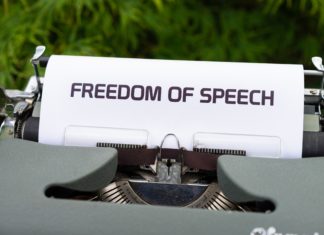 Concerns Grow Over Freedom of Expression On Campuses Across Nation A typewriter has a piece of paper in it with the words “Freedom of Speech” spelled out.